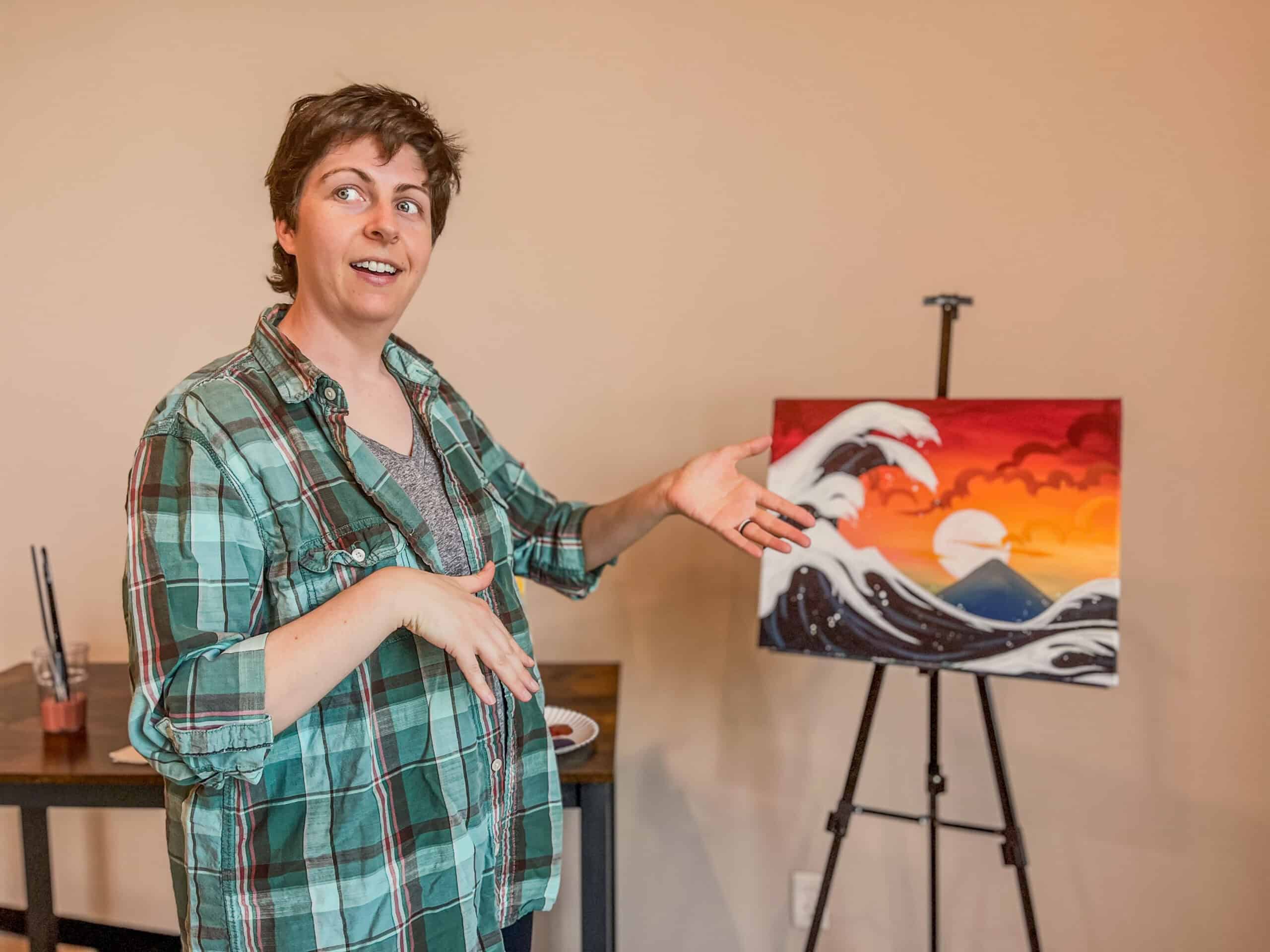 Laura teaching a sunset and waves painting
