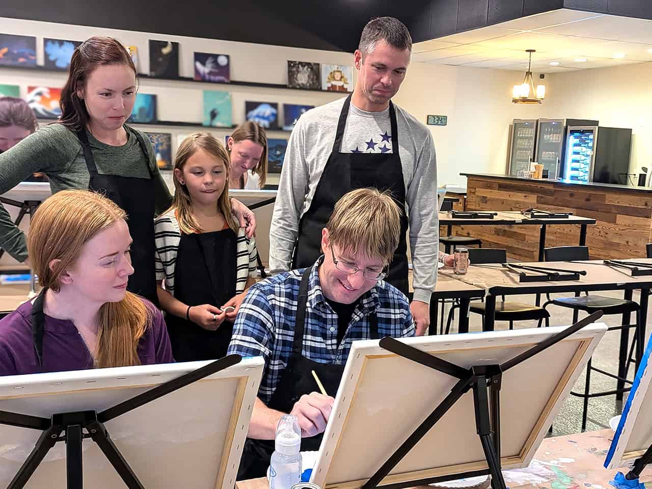 Man and partner doing couples painting